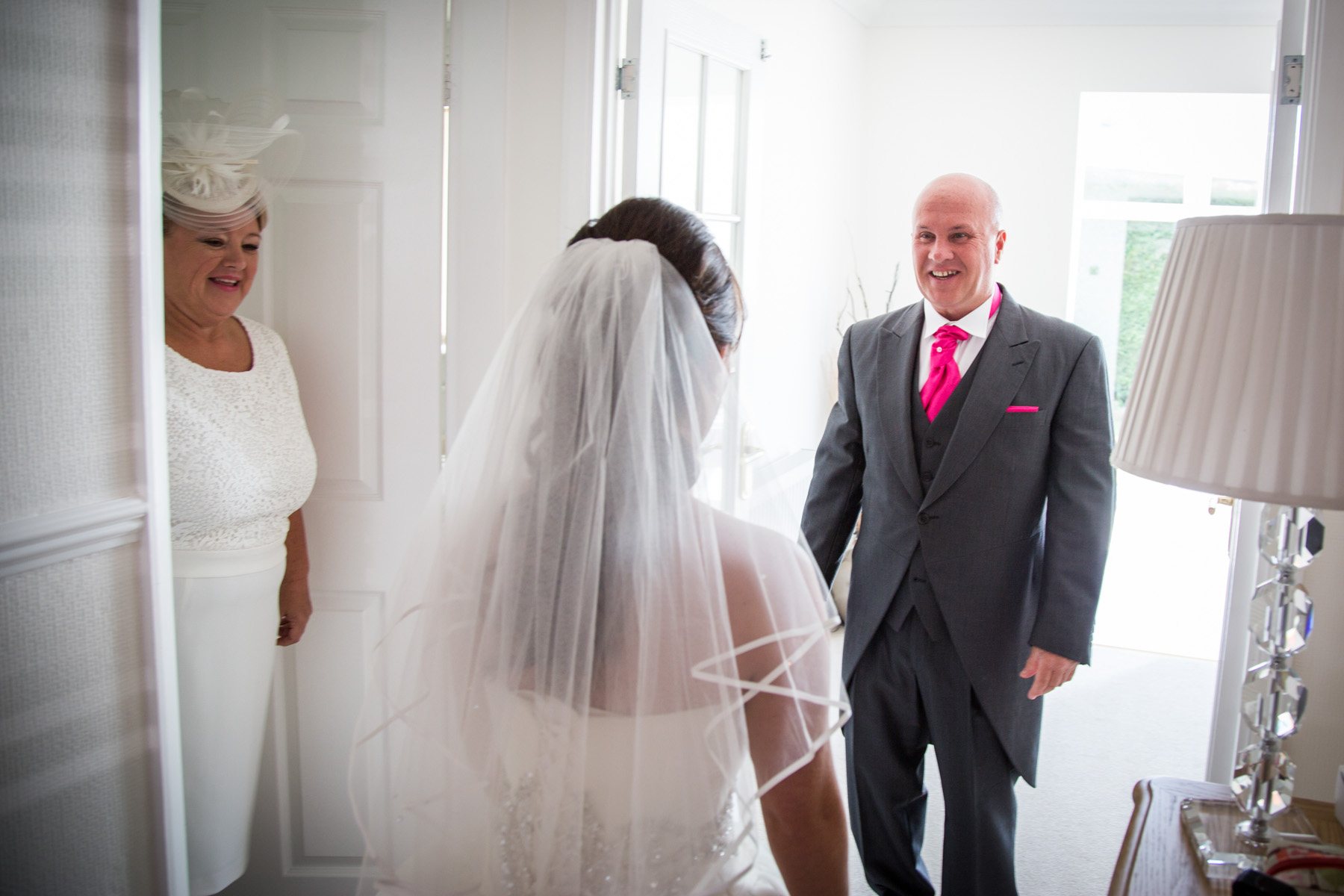 Mum and Dad looking at bride